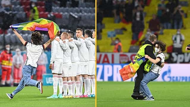 Fan invades pitch with rainbow flag before Germany vs Hungary Fan invades pitch with rainbow flag before Germany vs Hungary