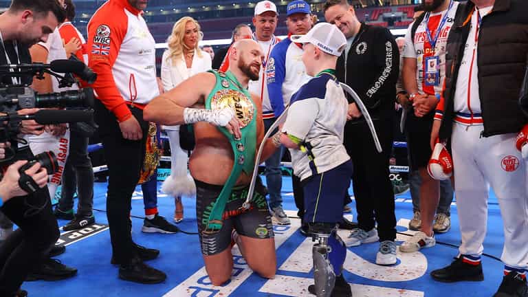 Tyson Fury invites young fan into ring after Dillian Whyte victory Tyson Fury invites young fan into ring after Dillian Whyte victory