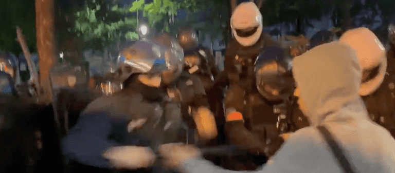 Liverpool fans appear to be attacked by riot police in Champions League fan zone Liverpool fans appear to be attacked by riot police in Champions League fan zone