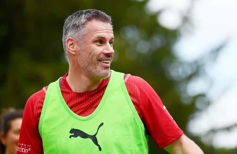 Jamie Carragher snatches phone from fan after being goaded in angry exchange Jamie Carragher snatches phone from fan after being goaded in angry exchange