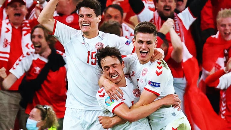 Delirious Danes reach Euro 2020 knockouts after 14 minutes of madness Delirious Danes reach Euro 2020 knockouts after 14 minutes of madness