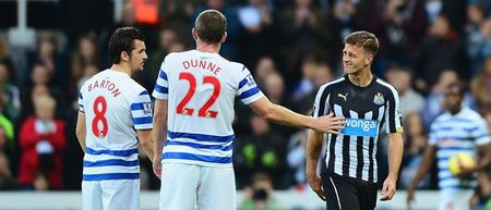 PIC: Richard Dunne consoles Ryan Taylor as injury forces him out of first league start in 32 months