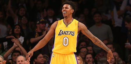 Lakers star Nick Young chases loose ball and throws up half-court buzzer beater