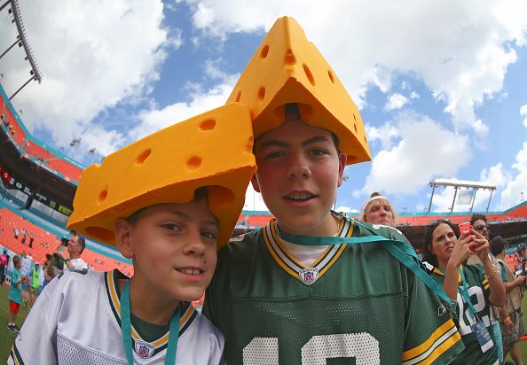 MIAMI GARDENS, FL - OCTOBER 12:  Green Bay Packers fans wear cheese headgear before the Miami Dolphins met the Green Bay Packers in their NFL game at Sun Life Stadium on October 12, 2014 in Miami Gardens, Florida.  (Photo by Mike Ehrmann/Getty Images)