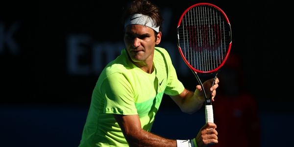 MELBOURNE, AUSTRALIA - JANUARY 21:  Roger Federer of Switzerland plays a backhand in his second round match against Simone Bolelli of Italy during day three of the 2015 Australian Open at Melbourne Park on January 21, 2015 in Melbourne, Australia.  (Photo by Clive Brunskill/Getty Images)