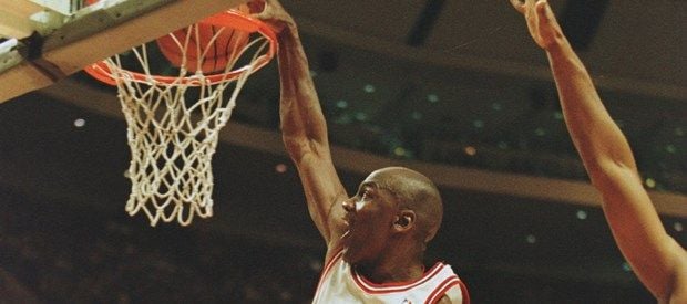 27 Feb 1996:  Shooting guard Michael Jordan of the Chicago Bulls focuses on the rim as he is caught in mid air attempting a slam dunk during the Bull's 120-99 victory over the Minnesota Timberwolves at the United Center in Chicago, Illinois.   Mandatory Credit: Brian Bahr/ALLSPORT