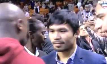 Manny Pacquiao and Floyd Mayweather exchange pleasantries at NBA game