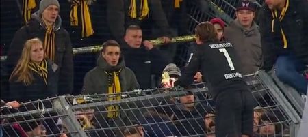 Video: Bizarre scenes in Germany as Dortmund stars climb fence to apologise to irate fans