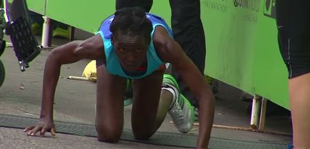 Video: Marathon race leader collapses and crawls agonisingly to finish line