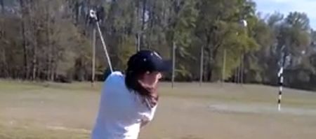 Video: Girl stacks two golf balls on top of each other and produces a pretty cool trick shot