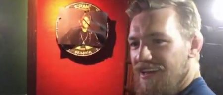 VIDEO: Oh nothing to see here, just Conor McGregor in Rio using Jose Aldo’s face as a dartboard