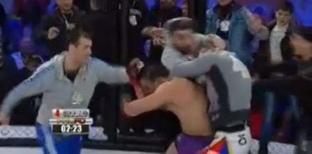 Video: Shocking scenes as flying knee KO sparks massive brawl at Russian MMA event