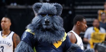 Video: NBA mascot leaps from ladder and puts rival through a table