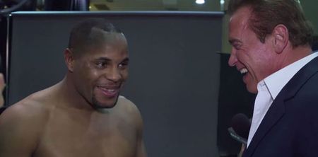 Video: Arnold Schwarzenegger crashes Daniel Cormier interview, makes fun of his belly