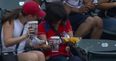 VIDEO: A foul ball, nachos and the world’s unluckiest woman have combined to make us chuckle