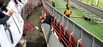 Video: Crowd assist allows Russian pitch invader escape match stewards