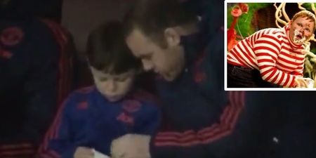 VIDEO: Wayne Rooney stuffs his face with sweets watching West Ham game with son