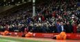 PIC: Jamie Carragher joined Liverpool fans who staged a 77th minute walkout at Anfield