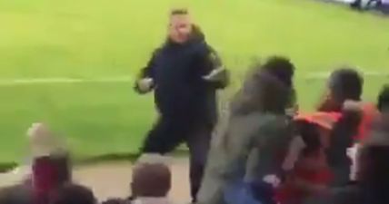 WATCH: Bravest (most stupid) fan in England decides to start fighting the entire away end