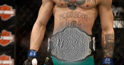 There’s something odd going on with Conor McGregor’s status as featherweight champion on UFC.com