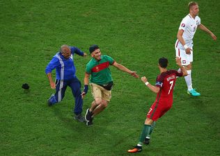 WATCH: Cristiano Ronaldo pulled off the sharpest sidestep when a pitch invader interrupted the Portugal game