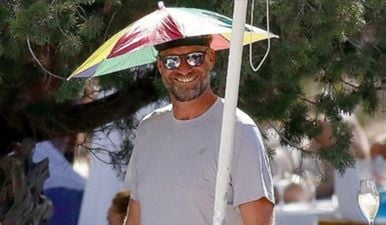 Jurgen Klopp’s flamboyant choice of headwear in Ibiza has got Neville and Carragher talking