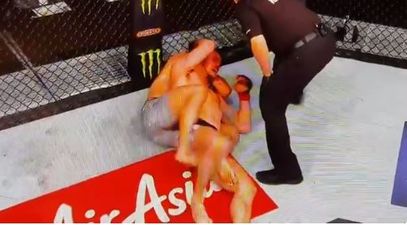 Georges St-Pierre chokes Michael Bisping unconscious to become UFC champion