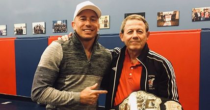 Georges St-Pierre gives new middleweight belt away to old wrestling coach