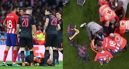 Diego Costa consoles Laurent Koscielny after he wails on the ground in pain