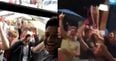 Alex Oxlade-Chamberlain is mobbed by fans while Carragher sings Salah song