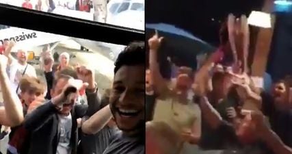 Alex Oxlade-Chamberlain is mobbed by fans while Carragher sings Salah song