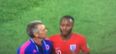 Colombia assistant barges Raheem Sterling as he leaves the pitch