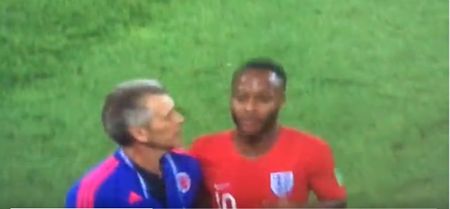 Colombia assistant barges Raheem Sterling as he leaves the pitch