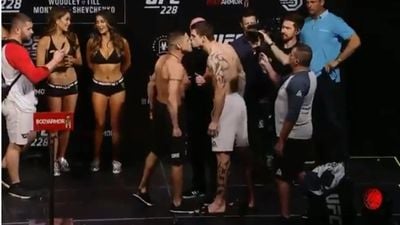 UFC fighters kiss on stage