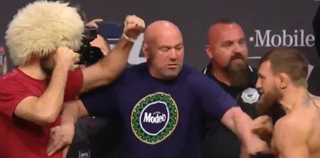 McGregor throws a kick as he has to be separated from Khabib at weigh ins