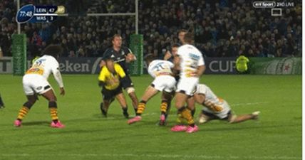 Leinster flanker Rhys Ruddock floors referee Romain Poite in back play