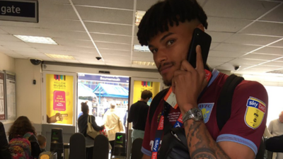 Tyrone Mings arrives at Bournemouth station still in full Aston Villa kit day after playoff win