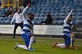 QPR players celebrate goal by taking a knee in front of Millwall fans