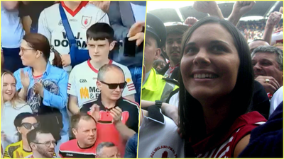 Armagh and Tyrone fans applaud the memory of Michaela McAreavey on 27th minute