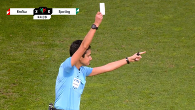 Referee shows white card during Sporting Lisbon vs Benfica