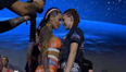 MMA fighters surprise crowd by kissing at face-off and flashing their breasts