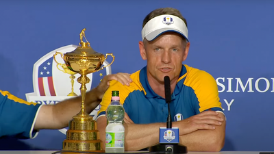 Shane Lowry comforts Luke Donald as he speaks about his late parents